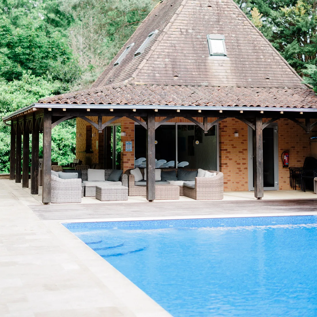 The swimming pool and its pool house