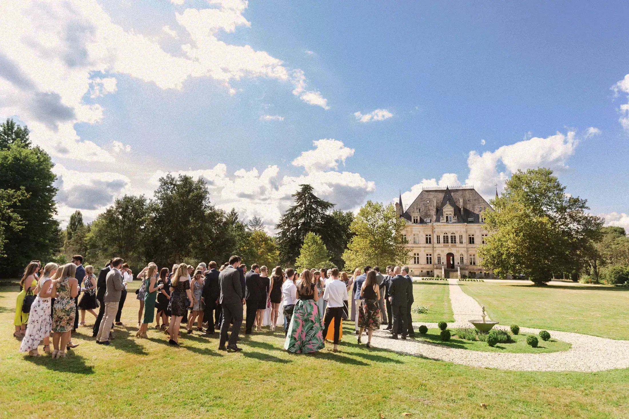 Cocktail hour on the lawn in front of the château