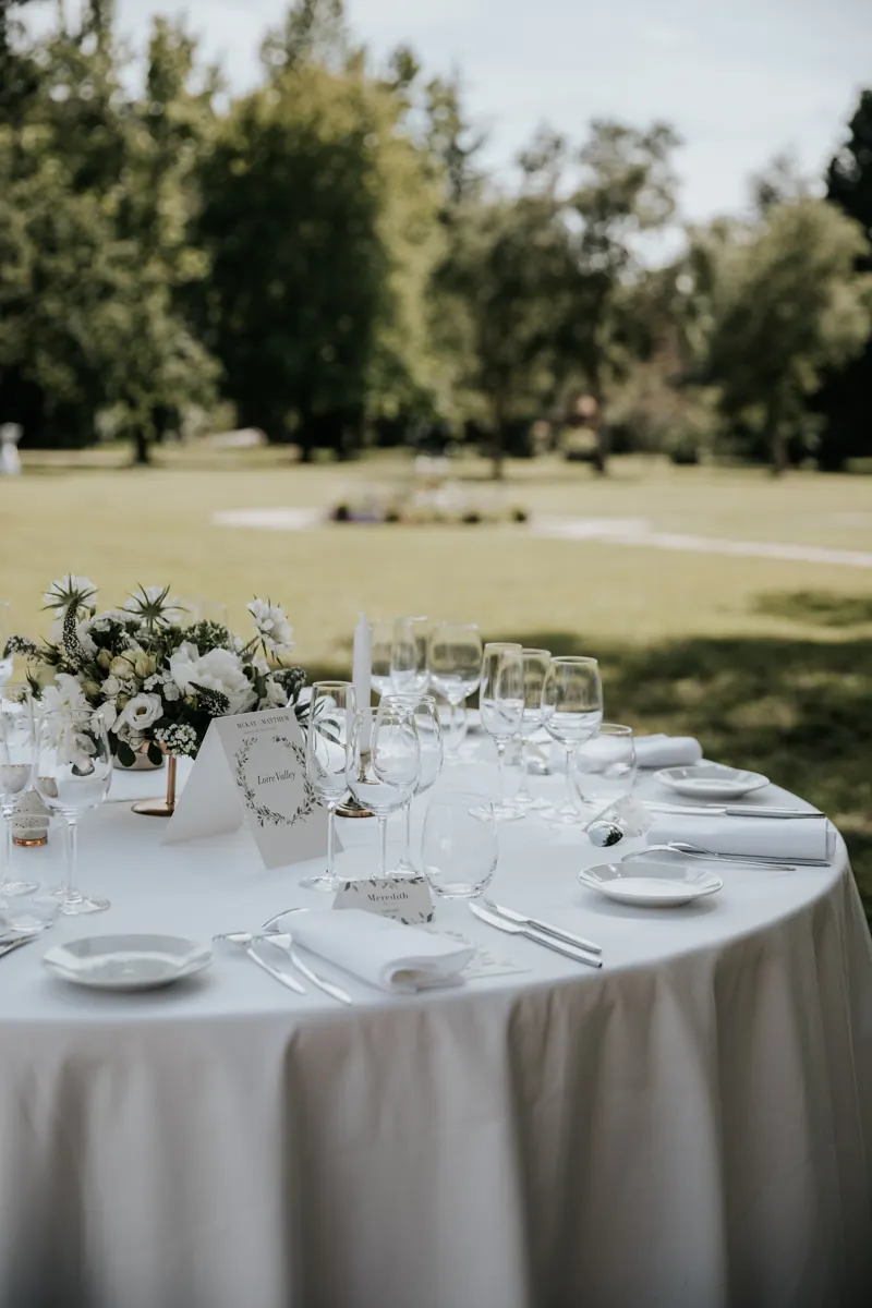An outdoor table laid, the place setting in detail
